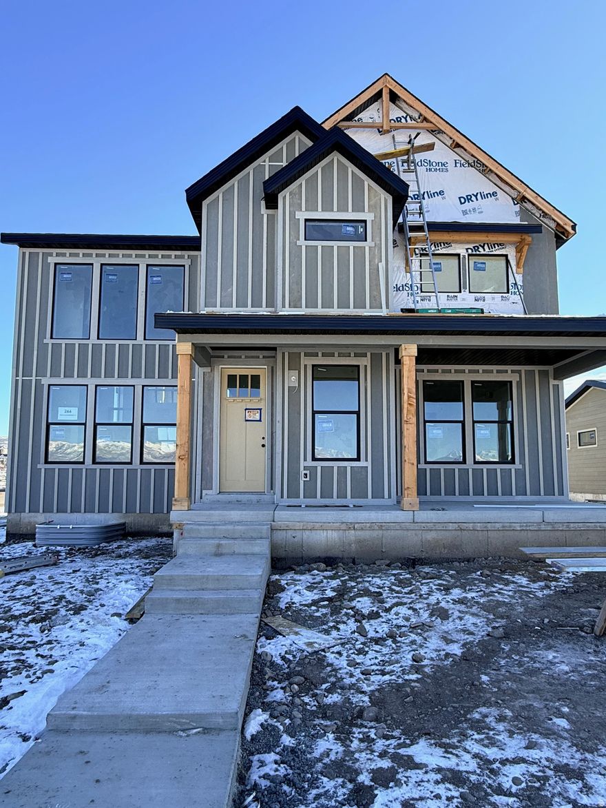 Huge Price Drop!!!  Welcome to this stunning, fully finished 2-story Ridgeview floor plan located in The Crossings in beautiful Heber, Utah. With 4,005 total square feet and a finished basement, this farmhouse-style home offers incredible space, comfort, and style-plus over $154,000 in premium options already included. Some of the features include a gorgeous gourmet kitchen with double ovens, High quality quartz countertops, High quality luxury Vinyl plank flooring, stainless steel appliances, 20 ft vaulted ceilings, Huge windows and closets and much more.  The gourmet kitchen is a standout, designed for both daily living and entertaining with upgraded finishes, generous workspace, and an easy flow into the main living areas. Outside, you'll love the clean look and convenience of a rear-load garage and park-style yards that add charm and community feel. Full landscaping is included, and yard maintenance is covered, making this home truly low-maintenance and move-in ready. Surrounded by gorgeous mountain views in every direction, The Crossings puts you close to everything Heber Valley is known for-minutes to Park City, nearby parks and trails, and two stunning reservoirs, Deer Creek state park and Jordanelle reservoir. This is a rare opportunity to own a highly upgraded home in an unbeatable  neighborhood without paying the park city prices.