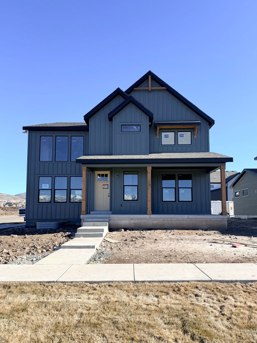 Huge Price Drop!!!  Welcome to this stunning, fully finished 2-story Ridgeview floor plan located in The Crossings in beautiful Heber, Utah. With 4,005 total square feet and a finished basement, this farmhouse-style home offers incredible space, comfort, and style-plus over $154,000 in premium options already included. Some of the features include a gorgeous gourmet kitchen with double ovens, High quality quartz countertops, High quality luxury Vinyl plank flooring, stainless steel appliances, 20 ft vaulted ceilings, Huge windows and closets and much more.  The gourmet kitchen is a standout, designed for both daily living and entertaining with upgraded finishes, generous workspace, and an easy flow into the main living areas. Outside, you'll love the clean look and convenience of a rear-load garage and park-style yards that add charm and community feel. Full landscaping is included, and yard maintenance is covered, making this home truly low-maintenance and move-in ready. Surrounded by gorgeous mountain views in every direction, The Crossings puts you close to everything Heber Valley is known for-minutes to Park City, nearby parks and trails, and two stunning reservoirs, Deer Creek state park and Jordanelle reservoir. This is a rare opportunity to own a highly upgraded home in an unbeatable  neighborhood without paying the park city prices.