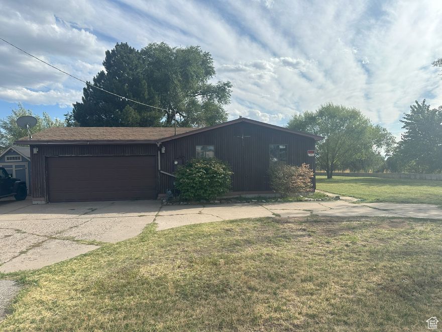 Discover the perfect blend of comfort and space with this 3-bedroom, 2-bath single-family home situated on 1.51 acres in beautiful Layton. With plenty of updates and room to grow, this property is full of potential.  The home features central heating and air (installed in 2012) for year-round comfort, along with durable LVP and hardwood flooring. Practical upgrades include a gas line added to the kitchen for a gas stove, new ABS waste lines replacing the original cast iron, and a newly built shed for extra storage.  Outdoors, you'll love the updated fencing, spacious yard, and a thoughtfully designed chicken run and coop-perfect for hobby gardening or simply enjoying the extra land. With over an acre and a half of space, the possibilities are endless-garden, workshop, outdoor entertaining, or even future expansion.  Enjoy the peace and space of country-style living while still being close to all that Layton has to offer-shopping, schools, parks, and easy highway access.  Don't miss this opportunity to make this versatile property your own. Schedule your showing today! *Home is To Be Sold in AS IS Condition*