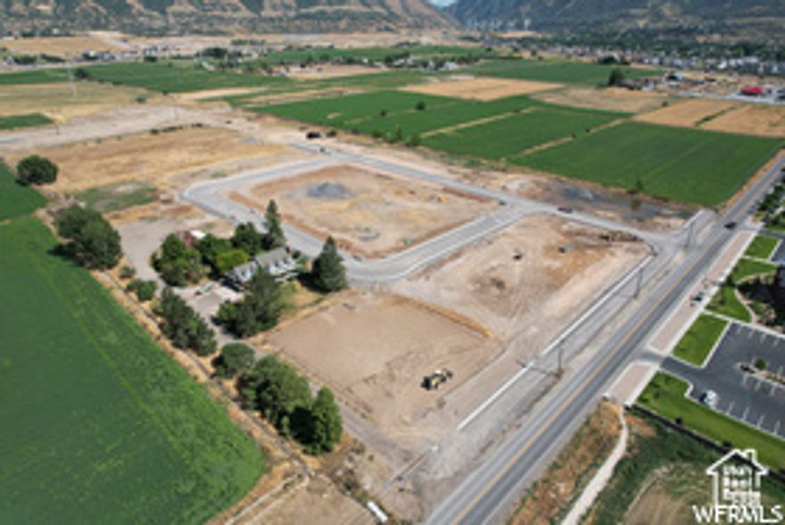 Beautiful buildable corner lot nestled in a quiet Spanish Fork community. Enjoy amazing mountain views near Maple Mountain High School. Bring your own builder or use ours!