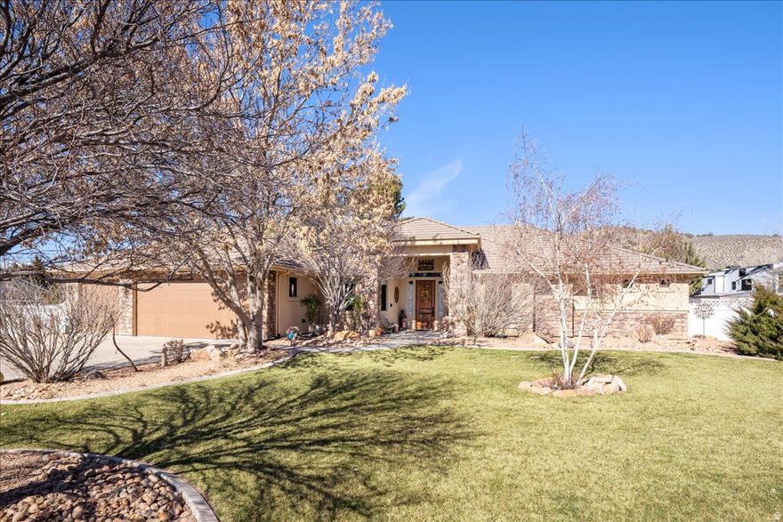 Out where the skies feel bigger and the neighbors come with hooves, this 4 bedroom, 3 bathroom home on .90 of an acre in Diamond Valley delivers the country lifestyle without sacrificing comfort or quality. This 4 bedroom, 3 bathroom home sits on .90 of an acre and blends quality construction with wide-open functionality. From the stone-accented front entry, you're welcomed into a spacious foyer framed by arched openings that lead into the main living area. The great room features a beautiful stone fireplace with custom built-ins, creating a warm focal point while still feeling open and inviting. Large windows bring in natural light and showcase views of the property. The kitchen and formal dining area are designed for gathering, offering rich wood cabinetry, generous counter space, and an easy flow that makes entertaining effortless. Durable flooring throughout the main living areas adds both style and practicality. The primary suite is spacious and private, complete with dual vanities, a soaking tub with tile surround, a separate walk-in tiled shower, and an expansive walk-in closet. Additional bedrooms are well-sized, and with three full bathrooms, there is flexibility for guests, a home office, hobbies, or multi-use space. A dedicated office and well-appointed laundry room add even more everyday convenience. Outside, the lifestyle truly expands. The covered patio provides shaded seating and mountain views, while the fully usable .90 acre lot includes covered corrals and livestock facilities ideal for horses or other animals. There is ample space for RV parking, trailers, equipment, and room to add a shop. A storage shed and fenced yard areas provide added functionality. This is Diamond Valley living done right. Space to roam, room to grow, and a home built to support the lifestyle you've been looking for.