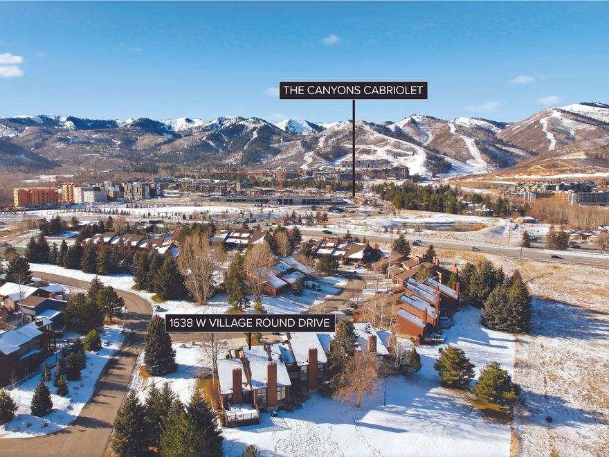 1638 Village Round enjoys a prime central location with easy walking access to the Canyons Cabriolet for effortless skiing at The Canyons, along with convenient access to Park City's Historic Main Street and Kimball Junction. Just outside the back door, Matt Knoop Park offers endless trails for hiking, biking, cross-country skiing, and snowshoeing. This spacious end-unit townhome offers a level of space rarely found in similar developments. The main-level great room features soaring vaulted ceilings, a wood-burning fireplace, and an abundance of windows, creating a light and inviting atmosphere. The space opens to two of the home's three expansive decks-one overlooking Matt Knoop Park and its trail system, and another with views of Iron Mountain-perfectly capturing the indoor/outdoor lifestyle that defines Park City living. The kitchen features newer appliances and opens seamlessly to the dining area and an additional deck, making it ideal for entertaining. The main floor includes two wood-burning fireplaces, one in the great room and another in the open dining area, adding warmth and charm throughout. The primary suite is located on the upper level and includes its own private deck with beautiful mountain views. This level also offers a spacious office or loft overlooking the living room, along with a large bathroom featuring a separate shower and jetted tub. The lower level provides a generously sized family room with windows, a large bonus room ideal for a home gym or personal retreat, a well-sized bedroom, and ample storage. An attached two-car garage offers plenty of space for vehicles, outdoor gear, and all your Park City toys.