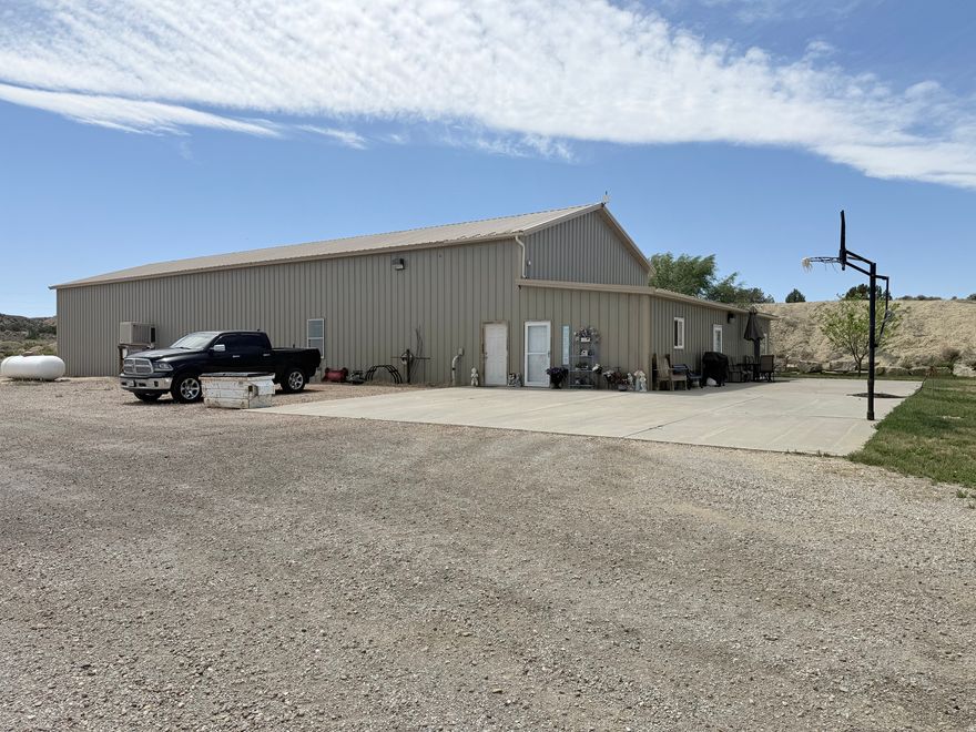 Exceptional commercial/industrial property located along the highly traveled Bonanza Highway with outstanding exposure and development potential. Situated on 30 acres, this versatile property offers a rare combination of residential living, large-scale shop space, and agricultural improvements, making it ideal for a variety of business or investment uses. The property was previously planned for future commercial development such as a truck stop, convenience store, or fuel station. Improvements include approximately 6,300 square feet combined, featuring a well-maintained 3-bedroom residence with a spacious primary bedroom and attractive Quakey wood cabinetry in the kitchen (2100 SF). The expansive 36'x150' shop is equipped with spray foam insulation, washer/dryer hookups, RV hookups, and two oversized 16'x14' overhead doors designed to accommodate large equipment or vehicles. A 40'x60' farm shed provides additional storage and functionality. Excellent opportunity for investors, business owners, or those seeking a live/work property with highway frontage and room to grow. Square footage figures are provided as a courtesy estimate only. Buyer is advised to obtain an independent measurement and verify all information.