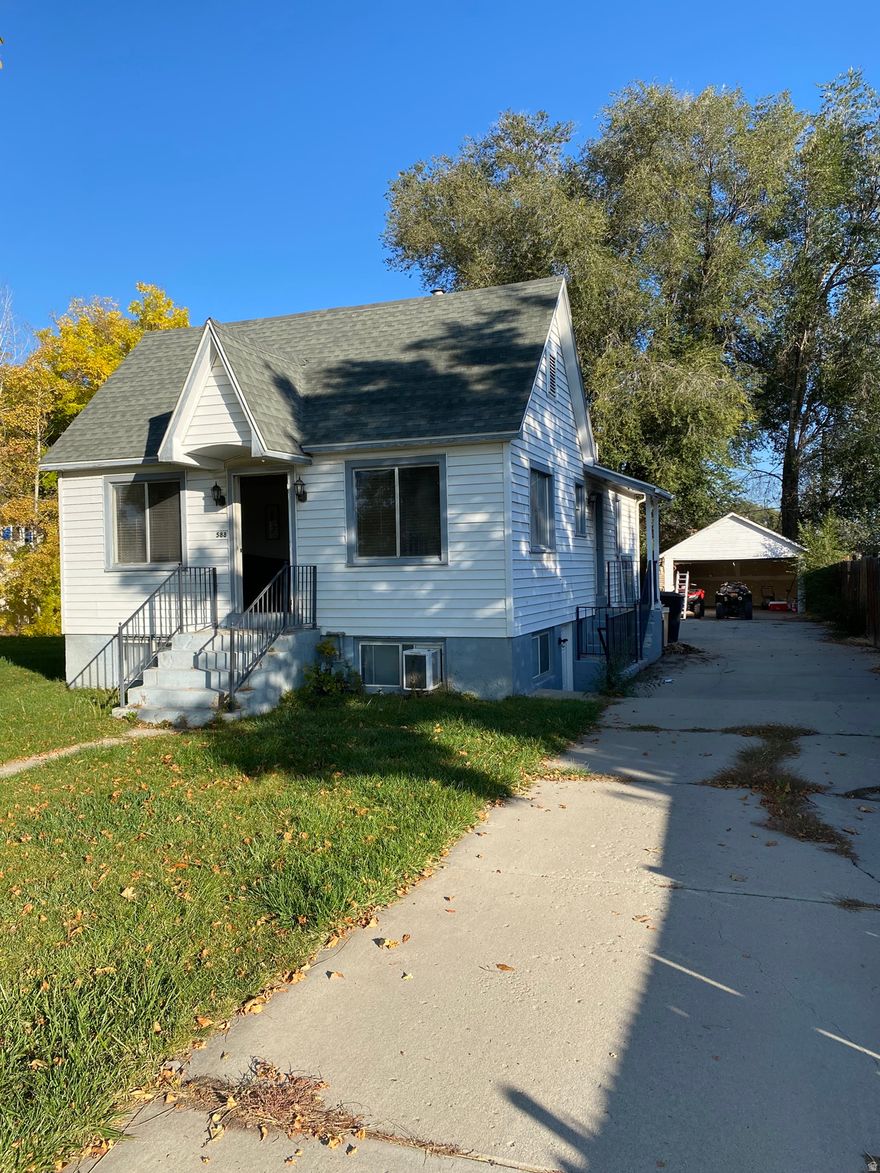 Fantastic opportunity with built-in income potential! This charming 3-bedroom, 2-bath home offers 1,700 sq ft of flexible living space on a generous .35-acre lot - with a downstairs level that can be rented separately for added cash flow or used as a private guest or in-law suite. The main level features bright, comfortable living areas, a functional layout, and inviting natural light throughout. Downstairs offers its own living space, creating an ideal setup for house hacking, multigenerational living, or short- and long-term rental income. Outside, enjoy a spacious yard with mature trees, plenty of room for entertaining, gardening, or future additions, and classic curb appeal with a welcoming front entry. Conveniently located near schools, shopping, dining, and commuter routes. Whether you're looking for a primary residence with extra income or a smart investment property, this home delivers versatility, space, and value. Don't miss this unique opportunity!