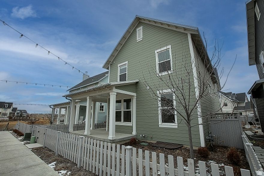 Welcome to this stunning, brand-new (2020) 2-story, 2,767 sq. ft. (including basement), 4 bedroom, 3.5 bath home located in the desirable Daybreak community of South Jordan. The open-concept main floor is perfect for entertaining, featuring soaring two-story ceilings in the great room, a modern recessed electric fireplace, and durable laminate hardwood flooring.  The upstairs master suite is a true retreat, offering a spa-like bathroom with a double vanity, a deep walk-in closet, and an extra-large walk-in shower with dual shower heads. The fully finished basement provides excellent additional living space with a family room, a bedroom, and a full bathroom.  A chef's dream, the gourmet kitchen is equipped with quartz countertops, an extended island, upgraded ceiling-height cabinets, a spring-spout faucet, a tile backsplash, and high-end GE appliances that includes a fridge with a built-in Keurig.  For convenience, the home includes an upstairs laundry room with a sink and cabinets, a front-loading washer and dryer, a tankless water heater, central air, and a dual-zone HVAC system.  The home also includes a 2-car, epoxy floor garage and a large driveway that provides ample parking for you and your guests.  Step outside into the large backyard, an ideal space for relaxation and gatherings, complete with a large deck, a hot tub, a gas fire pit, and a convenient gas hookup for your grill.   As a resident, you'll enjoy full access to Daybreak's numerous amenities, including Oquirrh Lake, a clubhouse, pools, tennis courts, parks, and a fitness center.  You'll also enjoy ready access to high-end shopping and restaurants at Mountain View Village, Costco, Target, Walmart, Downtown Daybreak - with the Megaplex theater, arcade and bowling - as well as the brand new Bee's ballpark and concert venue. All of this is within 5 miles.  Finally, you're within one hour driving of 9 world-class ski resorts and Park City.