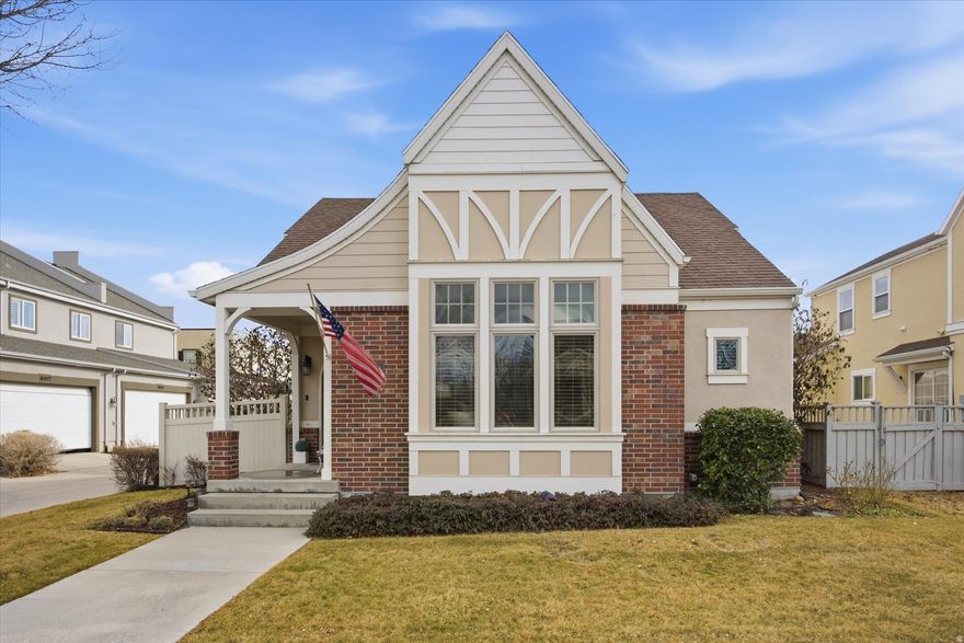 Walking distance to Oquirrh Lake in the Daybreak community, this beautifully maintained rambler offers 5 bedrooms, 3 bathrooms, and a dedicated office. The home features rich details throughout, including trimmed windows and casings and wood beams that add character to the open kitchen and living area. The great room offers airy ceilings, complemented by a spacious dining area and cozy eating nook. The main level includes a comfortable primary suite, a second bedroom, and a functional mudroom.