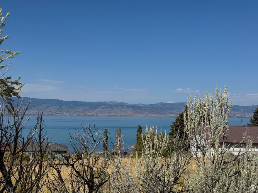 Beautiful Bear Lake VIEW lot with direct sandy beach access in gated lake-front subdivision with only 20 lots. Water hook-up fee paid, architect drawings included.  Septic has been previously approved, but would need to be updated. No Short-Term-Rentals.