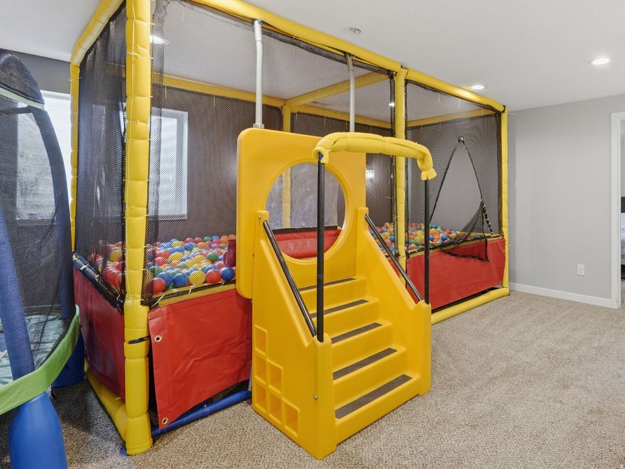 Welcome to the South Weber home that brings together space, function, storage, and entertainment in one unforgettable package. With RV parking, an extra-length garage, a private hot tub, basement wet bar, gym space, and a built-in ball pit, this home is designed for everyday living with serious personality.  A finished basement offers a true entertainment setup with a wet bar, gym/flex space, and a unique recreation area currently designed with a built-in ball pit.  Standout features include: RV parking, extra-length garage, hot tub, basement wet bar, gym/flex space, built-in recreation area, spacious backyard, swing set, and convenient access to Hwy 89, I-84, Ogden, Layton, Hill AFB, and Weber/Davis County amenities!