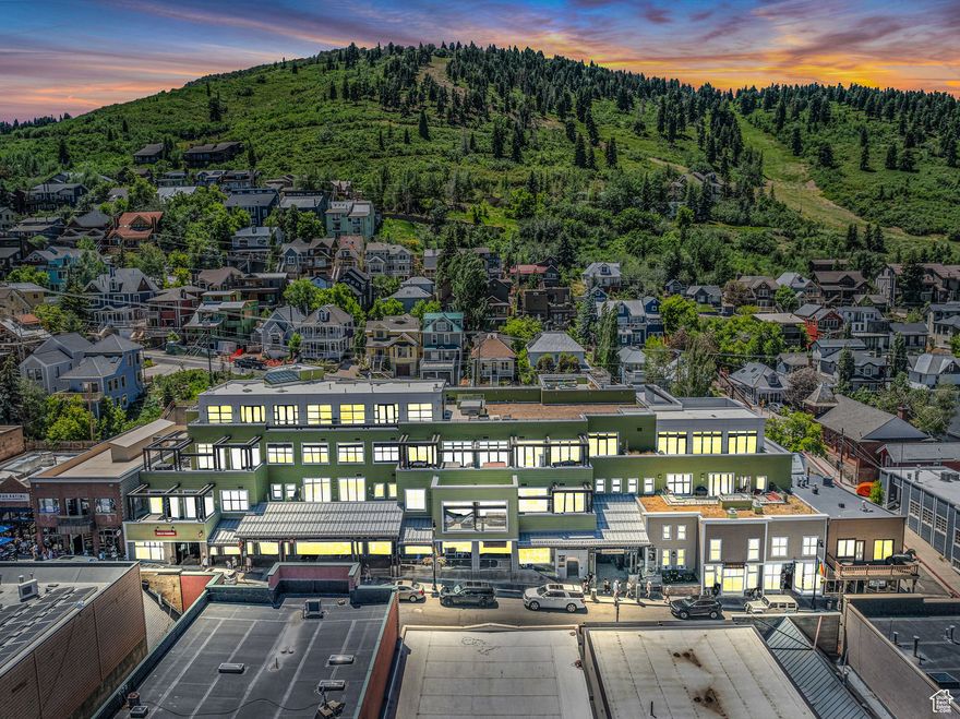 Located in the heart of Park City's Historic Main Street, The Parkite offers a unique collection of 15 exclusive residences, offering a rare combination of style, location, function, and amenities. Residence #10 offers an open floor plan, including a gourmet kitchen, three luxurious suites, living room, and a large media room that functions well as a flexible living or sleeping space.  As one of the few units at the Parkite, this residence has a large private heated outdoor deck with a hot tub. Have your morning coffee and enjoy epic views of Main Street, historic Old Town, and the Egyptian Theater. Buckle on your ski boots, grab your skis, and hop on the free Trolley that takes you to the Townlift for skiing. Additional amenities at The Parkite include a private large walk-in storage in the garage, one dedicated parking space, a gym, a dedicated ski locker, and an additional common area rooftop deck with a barbecue station and 360-degree views of historic Old Town. Enjoy exclusive dining and shopping right outside your door. Skiing is within walking distance, and Salt Lake City International Airport is 35 minutes away.
