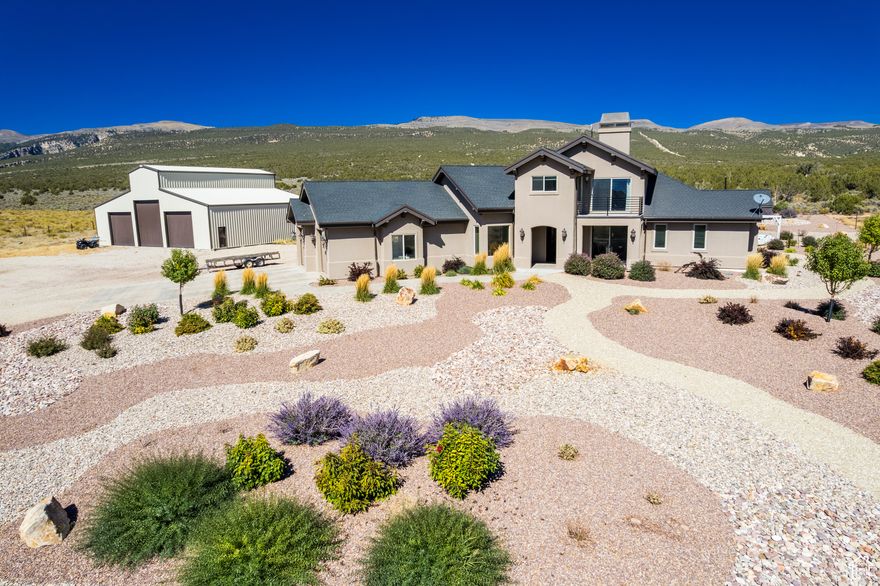 Breathtaking Off the Grid Custom Built Home on 11+ Acres!  This AMAZING property has 3,288 SQ FT, 3 Bedroms 3.5 Bathrooms, including the Primary Suite that is located on the Main Level. Primary Suite has double sink/vanities, a jetted tub and separate walk in shower with an oversized custom installed closets! Upon walking in you will appreciate the layout with an office/formal living room off the front door to one side and a formal dining room on the other. The two sided gas fireplace passes through to the Great Room which is open to the gourmet kitchen. Making this the perfect spot for entertaining guests! The kitchen boasts an oversized gas range, tiered island with granite countertops and custom cabinets!! You will find the remaining two bedrooms also on the main floor with a Jack and Jill bathroom. The second story is a great place for another living area, work out area,  or even a great spot to add a 4th bedroom or guest room. There is an additional bathroom on this level. With being off grid this home is on a well system, owned solar power and septic system. The BEAUTIFUL  yard surrounding the house has been xeriscaped with drip lines and has a custom firepit with seating. So much potential awaits with the acerage! Plenty of room for some livestock or crop! The shop is big enough to fit all your toys and/or projects at 62 X 50 with three doors on the front side and additional door on the backside. Too many features  to name!! PRE APPROVAL LETTER OR PROOF OF FUNDS are REQUIRED for showings.