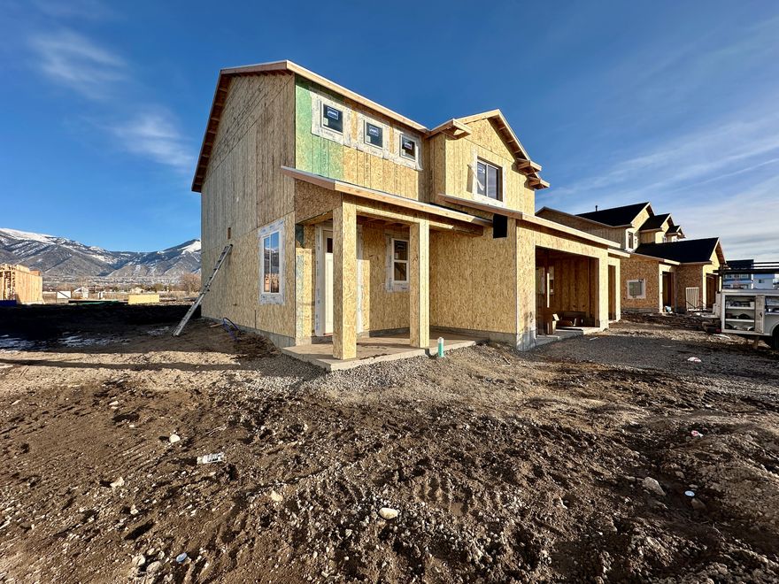 Welcome to the Stansbury floor plan-a stunning 2-story home with 3-car garage in Nibley's Firefly Estates Community. The main level boasts 9' ceilings and an open layout with luxury vinyl plank flooring throughout. In the kitchen, enjoy a large pantry, quartz countertops, single-basin, stainless steel sink, and knotty alder cabinets to the ceiling with large island. All bedrooms are located upstairs, along with nearby laundry room. The owner's suite features a tray ceiling, spacious walk-in closet, and beautiful bathroom with separate tub/shower. Estimated Completion: April 3, 2026 ***images are of another home with the same floor plan but different color options