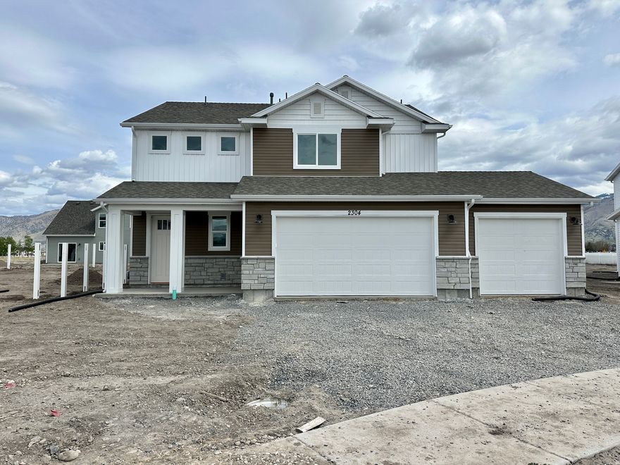 Welcome to the Stansbury floor plan-a stunning 2-story home with 3-car garage in Nibley's Firefly Estates Community. The main level boasts 9' ceilings and an open layout with luxury vinyl plank flooring throughout. In the kitchen, enjoy a large pantry, quartz countertops, single-basin, stainless steel sink, and knotty alder cabinets to the ceiling with large island. All bedrooms are located upstairs, along with nearby laundry room. The owner's suite features a tray ceiling, spacious walk-in closet, and beautiful bathroom with separate tub/shower. Estimated Completion: April 15, 2026