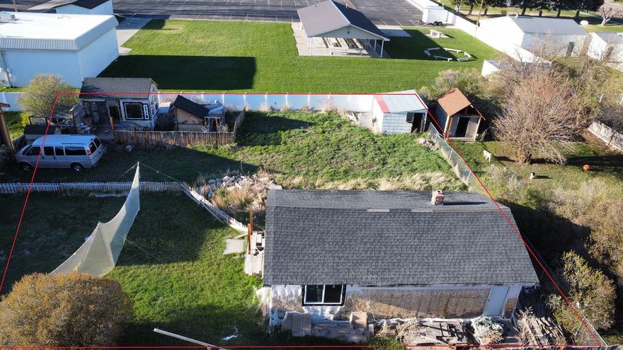 Spacious .19 acre lot in Montpelier Idaho. Lot has access off North 6th St. Easement will be recorded at closing. Water, Sewer, power and gas is available in the street. Older home on the property that is uninhabitable but cold be used for storage.  Contact listing agent for more info and to schedule your showings