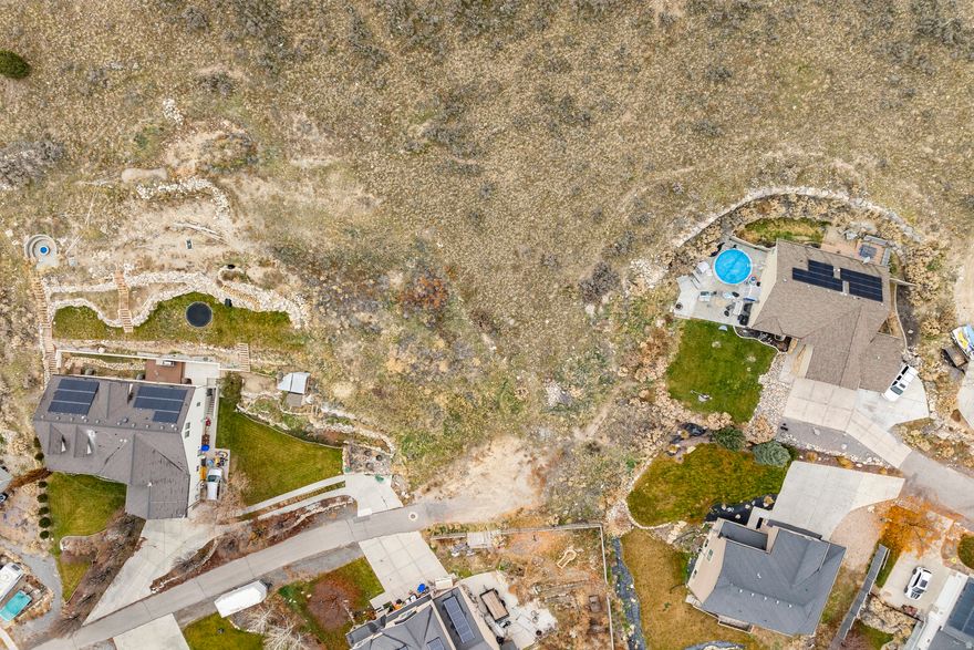 Discover the perfect setting for your future home on this .63-acre lot in beautiful Eagle Mountain. Situated at the end of a cul-de-sac, this gradual slope lot offers expansive views across the valley and vistas of Mt. Timpanogos. The neighborhood features well-kept homes, spacious parcels, and walking distance to parks and schools. Bring your own builder. Utilities are stubbed at the property line.