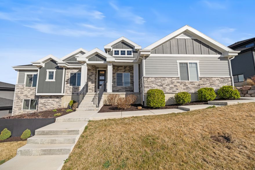 Seller financing available at 3% for 5 years! Contact agent for details. Located in the highly sought-after Traverse Mountain community in Lehi, this home offers views of Utah Valley and indoor-outdoor living. Featuring 4 bedrooms and 5 bathrooms, the home includes an open-concept layout, vaulted ceilings, and a kitchen with double dishwashers and a walk-in pantry with grocery door access from the garage. The primary suite offers a walk-in closet, soaking tub, and double-head shower. The finished basement includes a play nook and a dedicated theater setup. Enjoy a covered deck and a backyard with a private pool and hot tub. Includes a 3-car garage, HOA amenities with clubhouse and fitness center, and close proximity to Thanksgiving Point, shopping, dining, and freeway access.