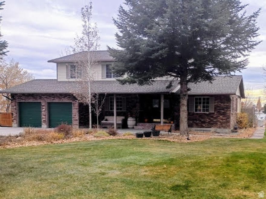 MOTIVATED SELLERS! ALL REASONABLE OFFERS CONSIDERED! Discover peaceful country living in this beautifully maintained 2-story home situated on 1.35 acres in the highly desirable Hillcrest Estates neighborhood, just minutes from Price and Wellington. Enjoy quiet surroundings with no highway or train noise, offering comfort, privacy, and space. This elegant home features over 3,300 sq. feet of living space with thoughtful updates and classic charm throughout. The main level offers an updated kitchen with a breakfast area, a formal dining room with charming saloon doors, a cozy family room with a beautiful brick fireplace and wood stove insert, and a formal living room. The upper level includes three spacious bedrooms, a full bathroom, and a  bath off the primary bedroom. The primary bedroom suite also features a large walk-in closet with built-in drawers and ample shelving. The fully finished walkout basement adds valuable living space with a second family room, bedroom, craft room, and utility room, and provides direct access to the backyard. Outdoor highlights include: automatic sprinkler system, greenhouse, charming sheepherder-style playhouse, established landscaping and two large outbuildings: 8' x 12' and 12' x 20'. Square footage provided as a courtesy estimate from Carbon County Tax Records. Buyer to verify all measurements.