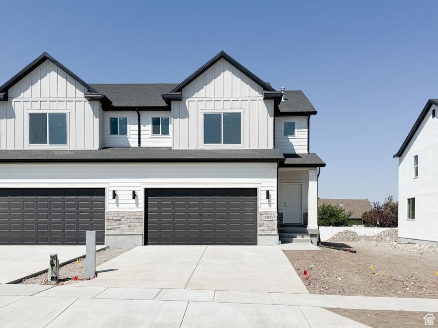The new Drysdale Twin Homes are the perfect place to settle. Tucked in the heart of the Overlake community and close to all amenities Tooele has to offer. The builder did not skimp on upgrades! The exterior is a beautiful craftsmen with upgraded stone, stucco, and hardy board. The interior you will find LVP flooring throughout the main level, laundry room, and main bath, painted white cabinets throughout the kitchen and bathrooms with soft close doors and drawers, finished with quartz countertops. The primary bath has separate tub/shower with upgraded tile. Enjoy the privacy of your own backyard that is already fenced! Builder will also provide front yard landscaping and sprinkler system.Perfect for kids and animals! Please ask about our $21,000 preferred lender incentive. Square footage figures are provided as a courtesy estimate only and were obtained from builder's plans. Buyer is advised to obtain an independent measurement. Pictures are taken from another unit, finishes may not be the same, but will be similar. Home will be ready November.