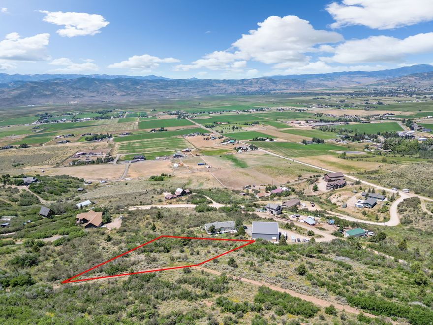 Tucked in the quiet hills of Kamas East, this 0.68-acre lot is the perfect place to build your dream home or private mountain cabin getaway. With panoramic views of Hoyts Peak and the scenic Kamas Valley, you'll enjoy peace, privacy, and a daily connection to nature. The lot is minutes from world-class skiing at Deer Valley, endless hiking and ATV trails in the nearby national forest, and fishing, boating, and paddle boarding at Jordanelle and Rockport reservoirs. Whether you're looking for a year-round home base or a weekend retreat, this property offers the ideal blend of adventure, seclusion, and easy access to both Kamas and Park City. Please note: the owner will need to apply for a water right and a start card in order to drill a well.