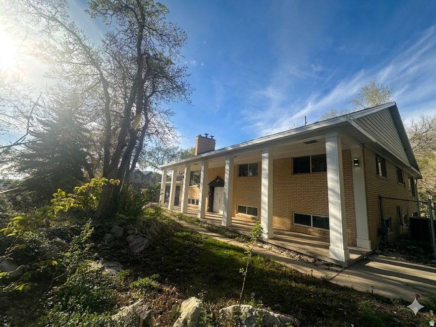 Welcome to this exceptional home located in the Uintah Highlands on .57 acres just under 4,600 square feet that blends comfort, style, and thoughtful design at every turn. Boasting 6 spacious bedrooms and 3 full bathrooms, this property offers all the room you need for luxurious living and effortless entertaining. Step outside to your own private oasis to a Trex deck perfect for lounging, grilling, or gathering with friends; a sparkling 20x40 in-ground, heated Salt Water pool, or enjoy the gorgeous yard that provides a sense of serenity with plenty of space to relax or play. Inside, the heart of the home is the showstopping primary suite, featuring an expansive, boutique-style closet that must be seen to be believed. This massive dressing space includes an all-in-one washer/dryer, adding unbeatable convenience and turning everyday routines into a true luxury experience. With generous living areas, a thoughtful layout, and standout amenities, this home delivers the ideal blend of elegance and practicality. Move-in ready and designed to impress-your dream home is waiting. Owner/Agent   Square footage figures are provided as a courtesy estimate only and were obtained from recent appraisal.  Buyer is advised to obtain an independent measurement.