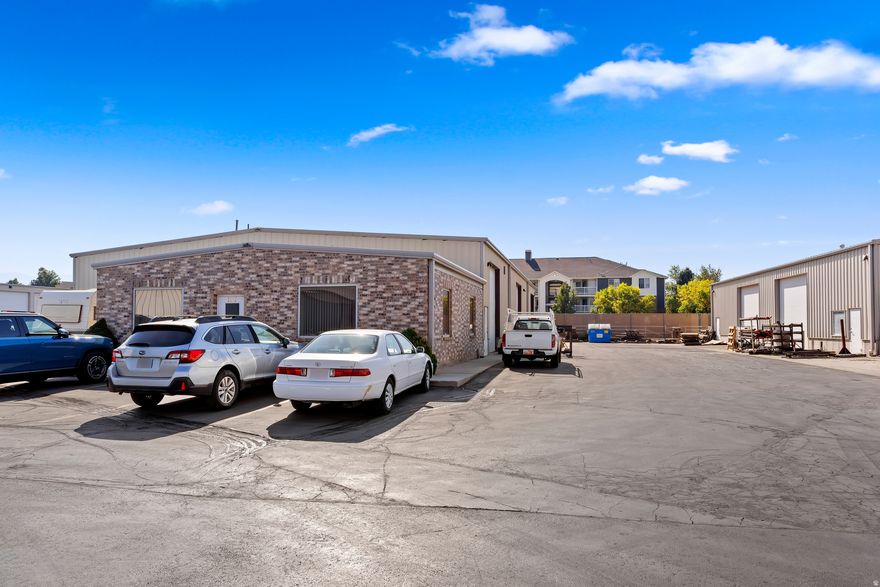 Available for lease, two warehouses offering a combined 14,760 square feet and zoned West Haven City C-2. The property at 1181 provides a 1,015 square foot office/showroom featuring a private office and breakroom, along with 7,171 square feet of open warehouse space equipped with three 14-foot-high by 12-foot-wide overhead doors, plus a 576 square foot storage mezzanine. The adjacent 1193 unit offers 5,340 square feet of open warehouse space with two 14-foot-high by 14-foot-wide overhead doors and a 660 square foot office area with a lobby. Surrounded by storage yard, these buildings boast a prime location just off West 21st Street, near a freeway exit, ensuring direct access to major roads and the freeway. Warehouses may be leased separately, please contact Agent for details.
