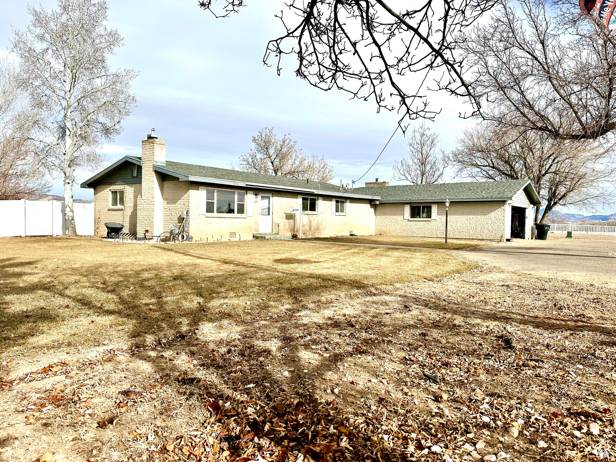 Nestled in a peaceful, desirable location just a minute from the Vernal Golf Course, this charming 3-bedroom, three 3/4 bath single-level home offers the perfect blend of comfort and country living. Situated on 1.10 fully fenced acres, this property is ready for your personal touch!  The kitchen, dining, and living room flow seamlessly together for easy living and entertaining. Fresh, new flooring throughout most of the home. Central AC & Forced Air Furnace, 2-Car Garage, large indoor storage room, Fully Fenced Yard: Perfect for pets and privacy, Sheds & Chicken Coops, New Sprinkler System: Connected to your own water well, ensuring efficient watering. Garden Area with Raised Garden Boxes: Also hooked up to the well for easy irrigation.  This home offers all the space and features you need to enjoy a relaxed, rural lifestyle with convenient access to Vernal's amenities. Don't miss out on this one-of-a-kind property-schedule a tour today! All information deemed reliable. Buyer is advised to obtain independent information.