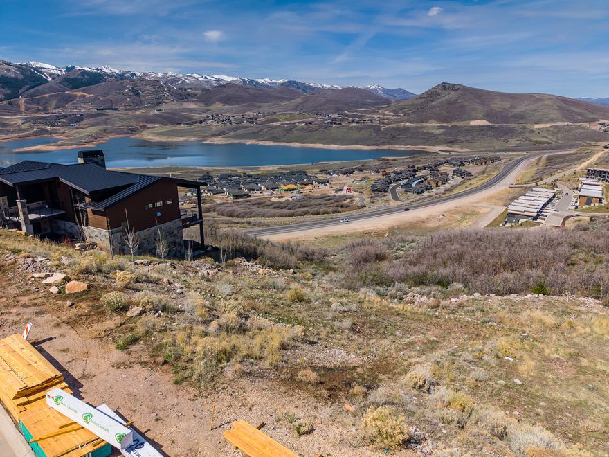 Build your mountain masterpiece on this prime 0.27-acre homesite in the prestigious Soaring Hawk community. Perfectly oriented for a downhill build, this lot offers the ideal topography for a stunning multi-level home with a walk-out lower level and Capture northwestern vistas of the sparkling Jordanelle Reservoir and the world-class ski runs of Deer Valley Resort. Enjoy a lifestyle defined by outdoor adventure with over 3 miles of community hiking and biking trails at your doorstep. Located just minutes from the new Deer Valley East Village and 18 minutes from Park City's Historic Main Street, you have world-class dining and skiing within reach while maintaining the peace of a mountain retreat. All utilities (water, sewer, gas, fiber) are available. No short-term rentals are permitted, ensuring a quiet, high-end neighborhood feel. Square footage figures are provided as a courtesy estimate only and were obtained from county record. Buyer is advised to obtain an independent measurement.