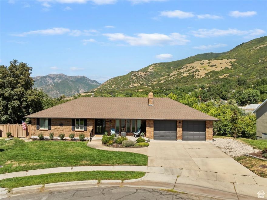 Situated on a peaceful cul-de-sac, this move-in ready home offers the perfect balance of sophistication, comfort, and function. The thoughtfully designed interior features traditional and flex spaces filled with natural light, stunning mountain views, a dedicated home office with built-in wraparound desk/cabinets, a cook's kitchen equipped with granite counters, stainless steel appliances, double-oven gas stove with vented hood, a newly remodeled main level bathroom, and gas fireplace for cozy evenings. The primary suite serves as a private retreat, complete with mountain views, a spa-like bathroom, and generous closet space with custom wood organizers. The walk-out lower level provides tons of storage, bedroom(s), a full bathroom, fireplace, and ample space for a family room, den, play space, or whatever spaces your family is dreaming of. Additional highlights include fresh neutral paint throughout, a full wired security network, solar tubes for tons of natural light, water softener, bonus parking space, and a heated oversized garage with built-in workshop-all contributing to the home's overall appeal. Step through the French doors to a large, covered deck ideal for entertaining or relaxing year-round. It overlooks an oversized, fenced backyard with no rear neighbors and backs the wooded Kays Creek Reservoir area, offering incredible views and true privacy. The yard is supported by a full in-ground irrigation system and secondary water, making outdoor maintenance both easy and efficient. Outdoor living is everywhere with a short drive to some of the most popular trailheads, Snowbasin Resort, or walking distance to the Kay's Creek Trailhead. Close to excellent shopping/dining and SLC, the home is in a family-friendly community near top-rated schools. This exceptional property delivers both elegance and livability in one of the area's most desirable locations.   All property information, boundaries and documents to be verified by buyer.