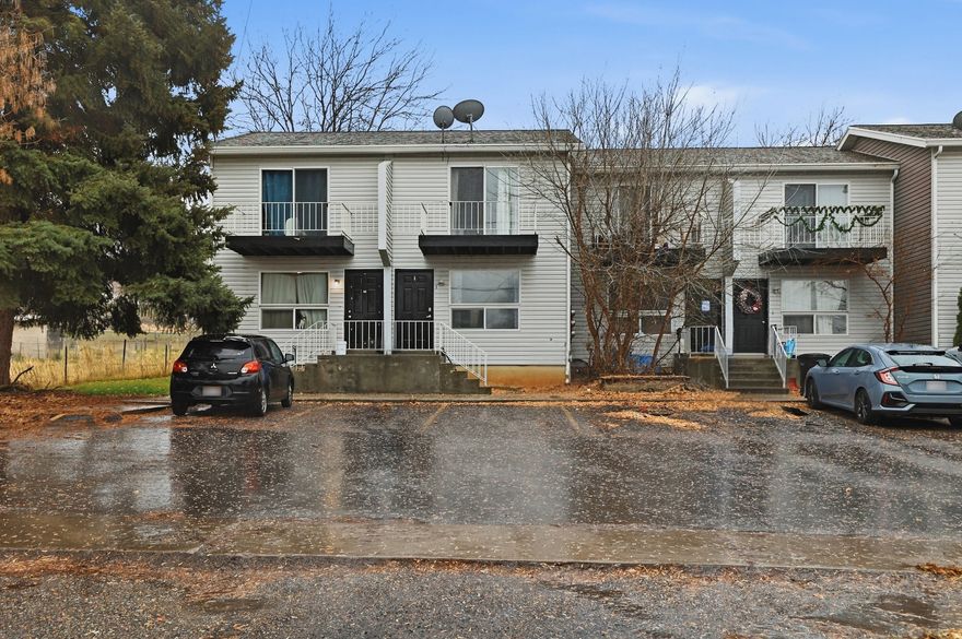 Cute, affordable townhome in the heart of Hyrum! This charming older unit offers 2 bedrooms and 1.5 bathrooms with a bright, open layout, fresh new paint and newer flooring throughout. Enjoy valley views from the balcony off the primary bedroom, plus a shared fenced backyard and private patio space-perfect for relaxing or entertaining. Two parking stalls conveniently located right out the front door. Ideally situated close to schools, shopping, and city parks. Refrigerator, washer & dryer included. Heated with electric ceiling coils. No HOA. Buyer to verify all information. Schedule your showing today!