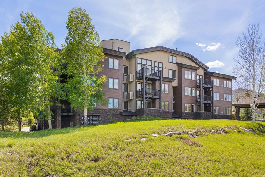 Welcome to this beautifully updated, fully furnished corner end-unit condo designed for effortless mountain living. Large windows fill the home with natural light, while the inviting living area features a cozy gas fireplace and sliding doors opening to a covered patio with mountain views, perfect for relaxing or outdoor dining. The kitchen offers maple cabinetry, quartz countertops, a gas range, pantry storage, and a custom backsplash. Luxury vinyl plank flooring and custom lighting continue throughout, while a newer mini-split system provides efficient heating and cooling. The spacious primary suite includes a walk-in closet and private ensuite bathroom with a double sink vanity and walk-in shower. The guest bedroom is conveniently located near a full bathroom, creating an ideal setup for family or guests. A full-size stackable washer and dryer add everyday convenience. Enjoy easy access to nearby trails and the clubhouse, with year-round hiking and biking just outside your door. Recent community renovations include new windows, sliding glass doors, roofs, decks, and new exterior. Community amenities include a clubhouse, pool, hot tub, and fitness center. The property also includes a designated parking space in the heated, secure garage and a private 8' x 7' storage closet ideal for skis, bikes, and outdoor gear. Additional conveniences include elevator access and covered outdoor parking. Ideally located in Kimball Junction, this condo places you just minutes from shopping, dining, and the free Park City bus route. Enjoy convenient access to world-class ski resorts, historic Main Street, and year-round recreation, all while being just 35 minutes from Salt Lake City International Airport. Whether you are seeking an investment property, second home, or full-time residence, this turnkey mountain retreat is ready to enjoy.