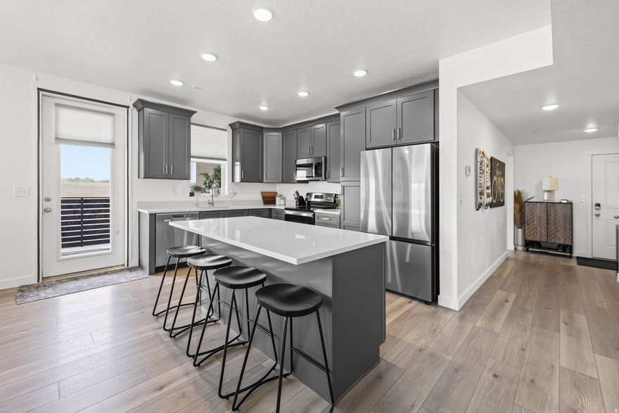 Welcome home to this beautifully maintained top-level condo in Midvale, built by Holmes Homes. Featuring 3 bedrooms and 2 bathrooms, this move-in ready unit offers an open-concept layout and incredible pond views from the balcony. All kitchen appliances are included. Enjoy a secure and spacious 2-car deep garage with extra storage. The HOA allows long-term rentals, making this a fantastic option for both homeowners and investors alike. Planned community amenities include a clubhouse, pool, and gym.  Please see virtual tour before scheduling a showing.