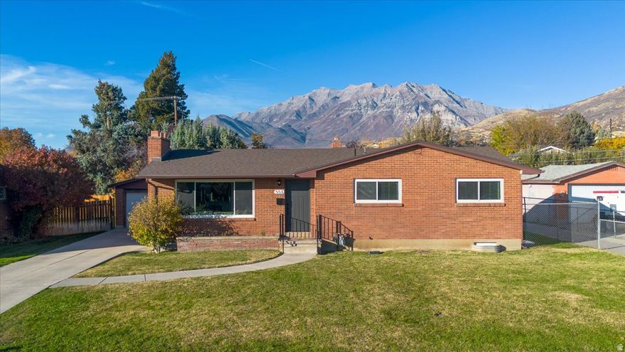 Recently renovated home in Provo's sought-after Edgemont neighborhood and within walking distance of Timpview High School and Edgemont Elementary, Brand-new carpet and paint throughout, modern lighting and hardware, and an upgraded kitchen featuring custom cabinets, a charming farmhouse sink, and new stainless steel appliances. Home features 5 bedrooms and 2.5 baths, with a bright, open front room complete with a cozy fireplace and spacious dining area-ideal for gatherings and entertaining. The large basement family room provides additional living space and endless possibilities for recreation or relaxation. Enjoy stunning mountain views from the fully fenced backyard, featuring a generous patio perfect for outdoor dining or play. Just minutes from Provo Canyon and BYU, this home offers incredible value in one of Provo's most desirable neighborhoods.
