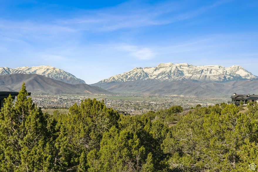 Situated in the prestigious Crown Ridge enclave of the award-winning Red Ledges, this serene homesite is priced under a million dollars and offers amazing unobstructed views across the Heber Valley to Deer Creek Reservoir and Mount Timpanogos. From this elevated setting surrounded by evergreens, take in breathtaking, panoramic forever views after a day enjoying the world-class community amenities including golf, tennis, pickleball, horseback riding, and swimming or a short drive to skiing, hiking, biking and boating. Experience radiant sunrises and dramatic sunsets from a property that feels like a private estate, yet is ideally located within one of the area's most coveted neighborhoods. This is a rare opportunity to secure a legacy property with full golf membership available where luxury living and natural beauty converge in perfect harmony.