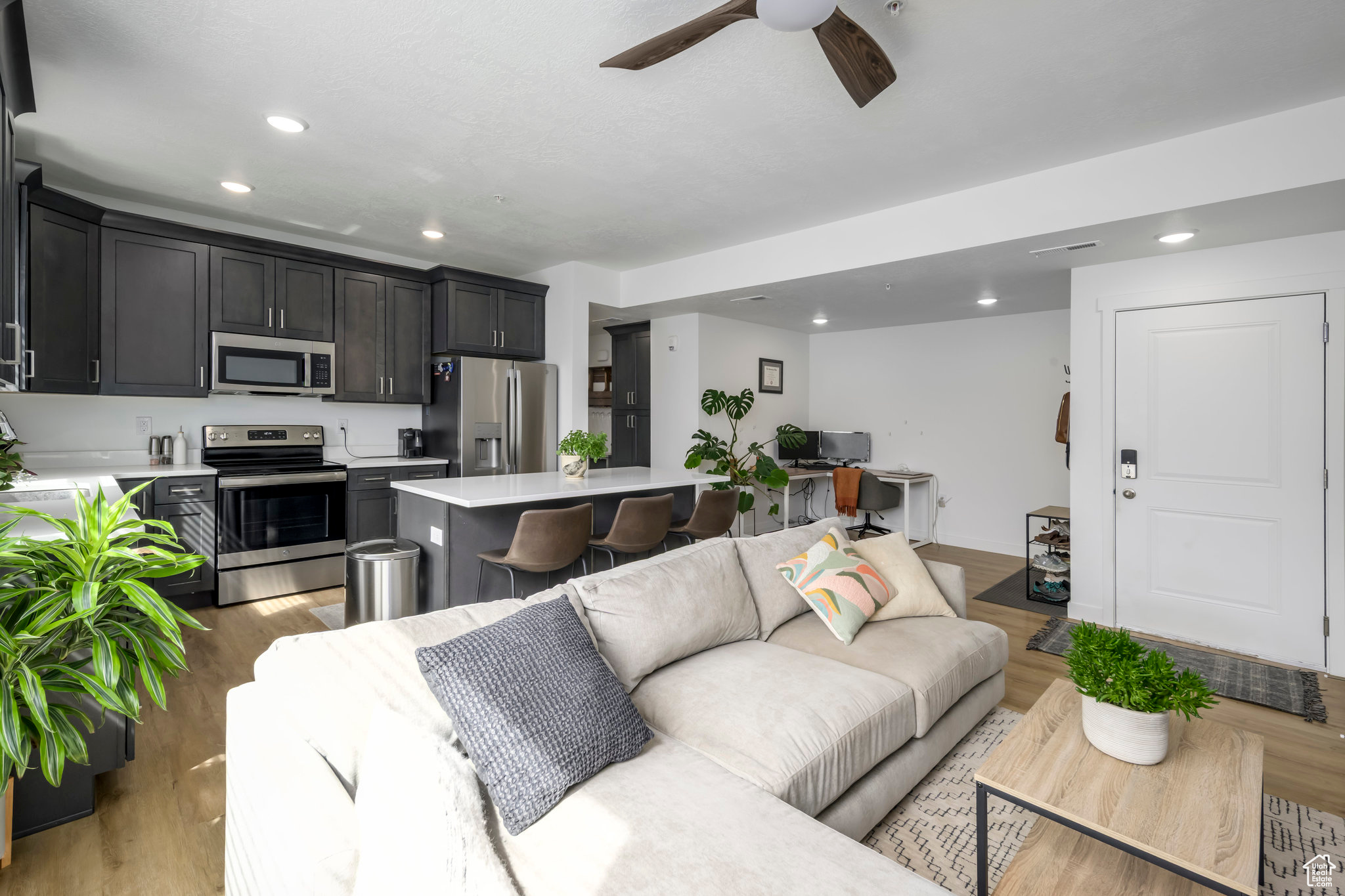 This immaculately clean and nearly brand-new Top-Level Condo is looking for its owner! This new community borders the Jordan River and offers tons of natural light for your plants, high ceilings, a modern kitchen, and views for days. This unit has ceiling fans and a custom storage shed at the front of the carport and we are priced well below the brand new options. Come on by for a peek, fall in love, and let's get into your new home! HOA does allow long-term rentals! Buyer to verify all!