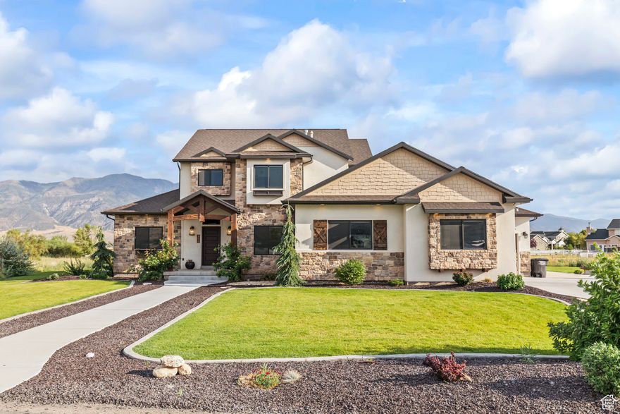 This AMAZING Richfield home sits on .85 acres with mountain views and room for horses. Nearly 4,000 sq ft, 5 bedrooms, 3 bathrooms, and a 3-car garage with overhead storage, sink, and drinking fountain. Inside, quartz countertops, tile, high-end fixtures, finishes, and pocket doors maximize space and light. Some unique features include an indoor slide, fun nooks for kids, and a hidden "Narnia" room with a built-in stage. The upstairs living area is wired for a projector, and the large back porch is ready for a flatscreen TV, making it ideal for entertaining. Outside, the property is fully landscaped with sprinkling system, garden boxes, fruit trees, and berries. A basketball standard, natural-gas fire pit, and barbecue area add to the outdoor living. Great neighbors, open views, and modern design make this home a rare find in Richfield!