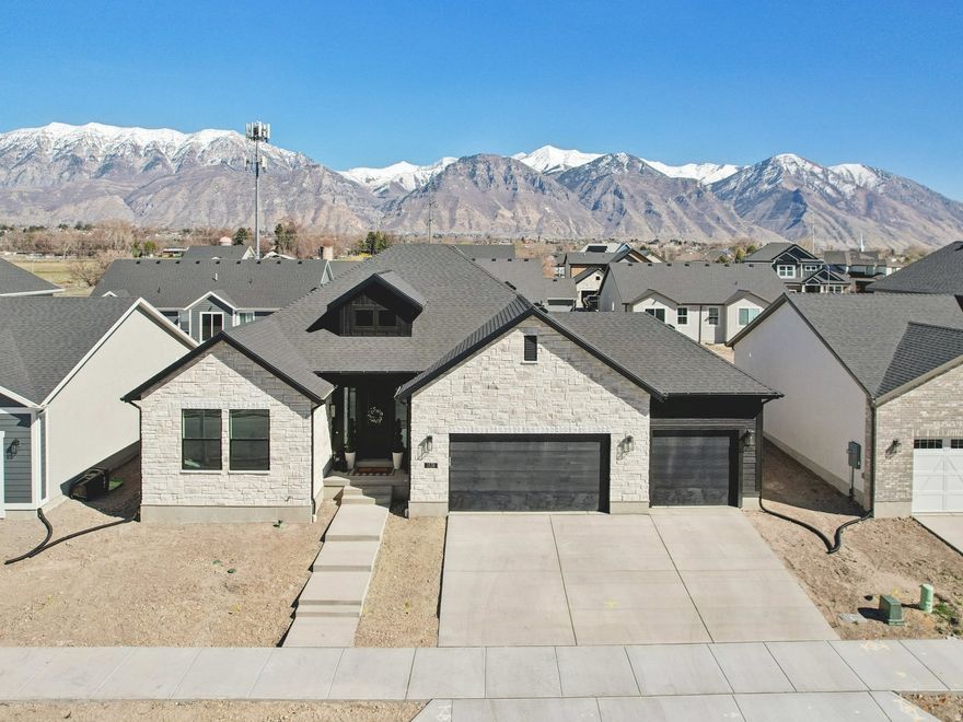 Brand new, custom move in ready home in Provo with stunning mountain views and a layout that just makes sense. Tucked in a quiet neighborhood, this home offers both privacy and convenience. Inside, you'll find bright, open spaces filled with natural light and a comfortable flow that works for both everyday living, entertaining, or working from home. The fully finished basement with a separate entrance provides excellent flexibility, guest setup, private living space, or extended living. You're just minutes from Utah Valley University (UVU) and Brigham Young University (BYU), as well as shopping, restaurants, the Provo Airport, and I-15, making daily life and commuting simple. Seller is offering up to $20,000 toward closing costs or a rate buy-down for qualified buyers, plus a preferred lender credit. Agent owned.