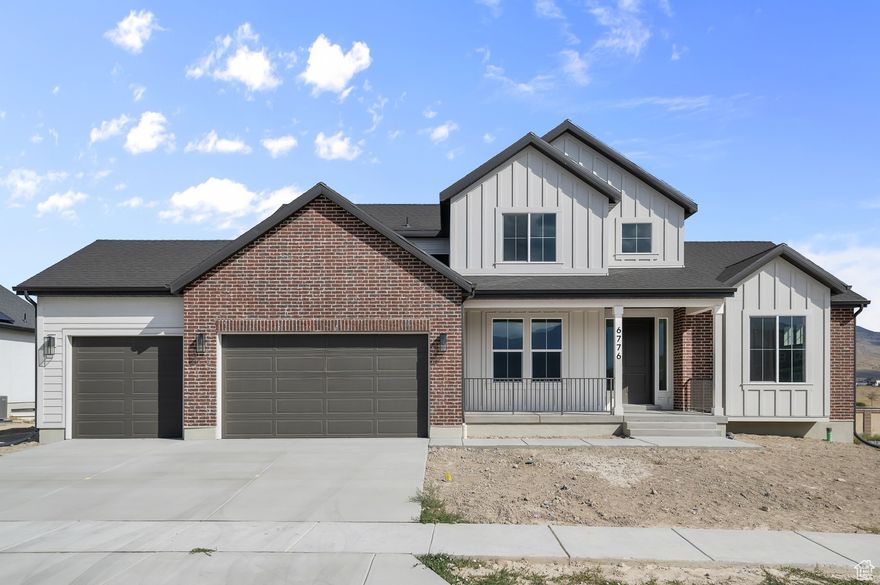 Come see this brand new Hamilton Traditional home in the great Overland master planned community! This home showcases a modern kitchen with bluff maple cabinets, quartz countertops, a tile backsplash and stainless steel gas appliances with a double convection oven, creating a chef-ready cooking space. Laminate hardwood, tile, and carpet flooring provide a warm and functional foundation throughout the home. Enjoy spacious living with 9-foot basement foundation walls and a three-car garage with exit door. Style meets practicality with Christmas light package and a cozy gas log fireplace. Outdoor living is enhanced by an expanded deck, perfect for entertaining. The owner's bathroom features tile surrounds paired with brushed nickel hardware for a refined finish. Additional details include textured walls, two-tone paint, and large contemporary base & casing, elevating the home's modern appeal. Includes access to the community barn and pool with HOA.