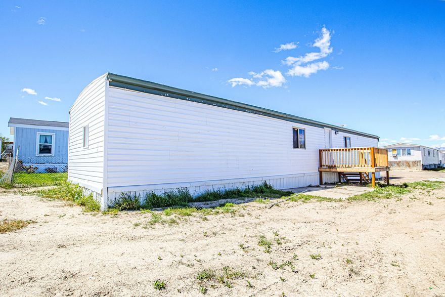 Welcome to Lot 20! This 2 bedroom 2 bathroom home features a main floor laundry, primary bedroom and bath on the main floor, kitchen include stove, and fridge. Cute, Clean, and move-in ready! Conveniently located! Square footage figures are provided as a courtesy estimate. Must pass background check. Can not be moved.