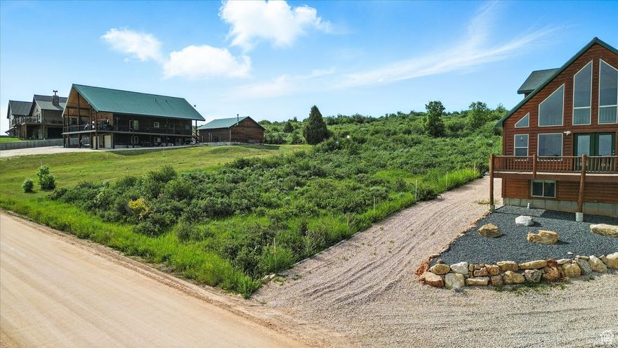 Build your dream home near beautiful Bear Lake! This gently sloped lot offers easy construction access and could save you up to $20,000 in site prep. The sewer connection ($7,000 value) is prepaid and included, adding even more value. Enjoy excellent lake access and proximity to the nearby bike path starting at Harbor Village-perfect for outdoor enthusiasts. Located in a gated community with no short-term rentals allowed, this lot offers peace, privacy, and a true neighborhood feel. The property also backs to common area, giving you extra space and no backyard neighbors. Ideal for a vacation retreat or year-round living!
