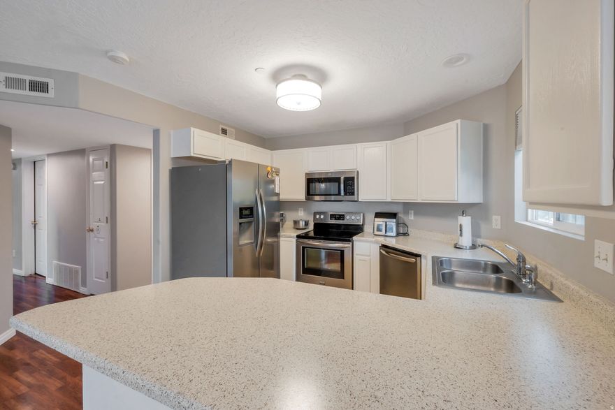 Come see this charming condo in the heart of Bluffdale-now offered at a new price! Perfectly located with quick and convenient freeway access, this home also offers the rare benefit of being within walking distance to grocery shopping, entertainment, and more. Nestled in a quiet community within one of the area's most exciting and rapidly growing neighborhoods, it provides both comfort and convenience. Offering newly painted cabinets for a fresh new look. The well-designed layout features 3 bedrooms and 2 bathrooms, offering comfortable, functional living with a space that's easy to maintain and enjoy. Don't miss the opportunity to own a beautiful home in a fantastic location with low-maintenance living!