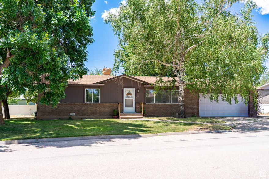 Excellent location in fun family neighborhood. You will love this cute 2-bedroom, 2-bath home in Monticello with room for your hobbies! There are recent updates including LVP flooring, updated lighting in the living room, a new kitchen faucet, new baseboards throughout, a brand-new dishwasher, new outlets and switches, and fresh paint. The attached garage is spacious and packed with many cabinets and hooks making it easy to organize your storage. For hobbies or a green thumb, you'll love the numerous outbuildings, including three sheds and a greenhouse hooked up to power, water, and gas, allowing for temperature-controlled growing all winter. Also in the backyard are apple and apricot trees, and two tree swings. Plus, the location is fantastic - neighboring the aquatic center, ballpark, hospital, and schools!
