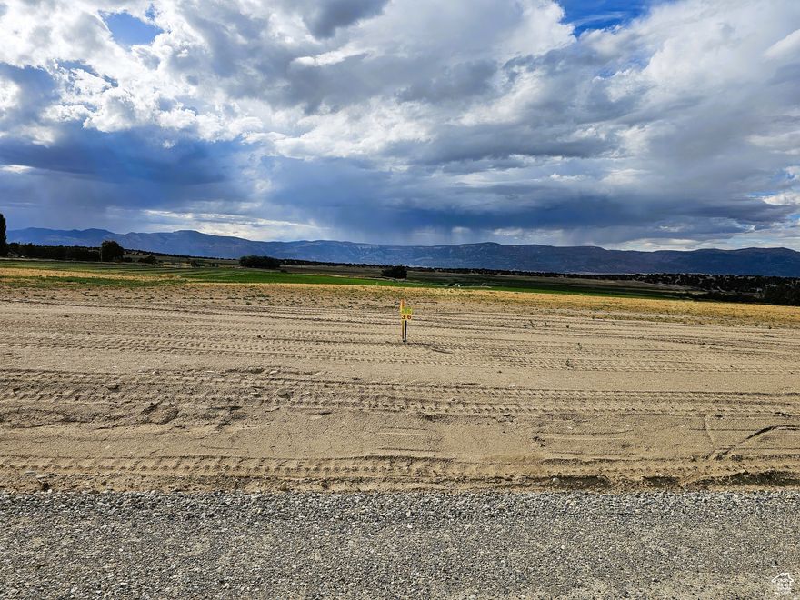 Building lot SPECIAL with your choice of $16,000 in down payment assistance or a 3.99% finance rate (25% down, 15-year amortization with a 5-year balloon) We can help connect you with financing! This lot comes with views, no HOA, private land, power, water and almost 3.5 acres of all usable land ready to build on! Set in a former alfalfa field. Get away from it all and enjoy country living in the Sanpete Valley, just south of Spring City, with wonderful views of Horseshoe Mountain and the rest of the Manti La-Sal's. Build your dream home and escape the traffic and noise. Just an hour from Utah Valley and Costco. Fresh clean air and gorgeous star-filled night skies for you to enjoy. Year-round access on a maintained and snowplowed county road. Power is available at the property line through Spring City. Sewer would be a septic system. Water is connected and provided by a shared private well in which you will own your own water. Natural gas is available on 1100 South. Easy access to Spring City Canyon and the National Forest and the 360-mile Skyline Drive trail system for all the fun Mother Nature has to offer. Enjoy all of the small-town amenities within 5 minutes of this property like a hospital, grocery and hardware store, indoor swimming pool and even a drive-in theater. There are additional lots for sale. MLS map is correct and Google Maps/Earth are 39.46253, -111.50453 Buyer to verify all information