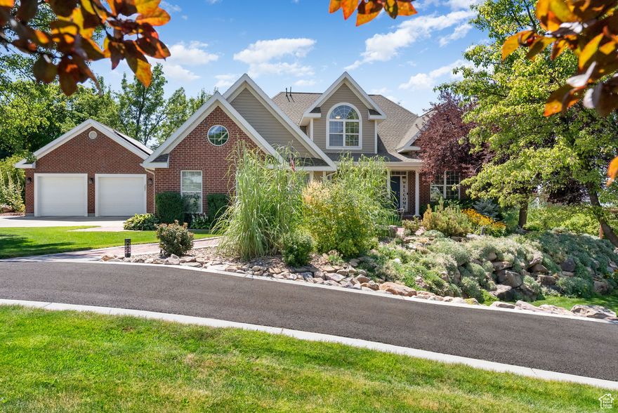 PRICE IMPROVEMENT!  Beautiful 6-bedroom, 3.5-bath home on a corner lot featuring a finished basement ADU with kitchen and laundry. Solar panels (paid in full) keep utilities low. Recent updates include a double-sealed asphalt circle drive and a new refrigerator. The main floor offers an amazing dedicated office, plus dual heating and A/C systems for comfort year-round. Additional highlights include an RV pad, 2-car attached and 2-car detached garages, 2 irrigation water shares, large laundry room, craft room, bonus/play room, laundry chute, and abundant storage. Outdoors you'll enjoy a full sprinkler system, mature landscaping, and a spacious back deck. Located minutes from Cherry Peak Ski Resort this home is move-in ready with comfort, efficiency, and income potential.