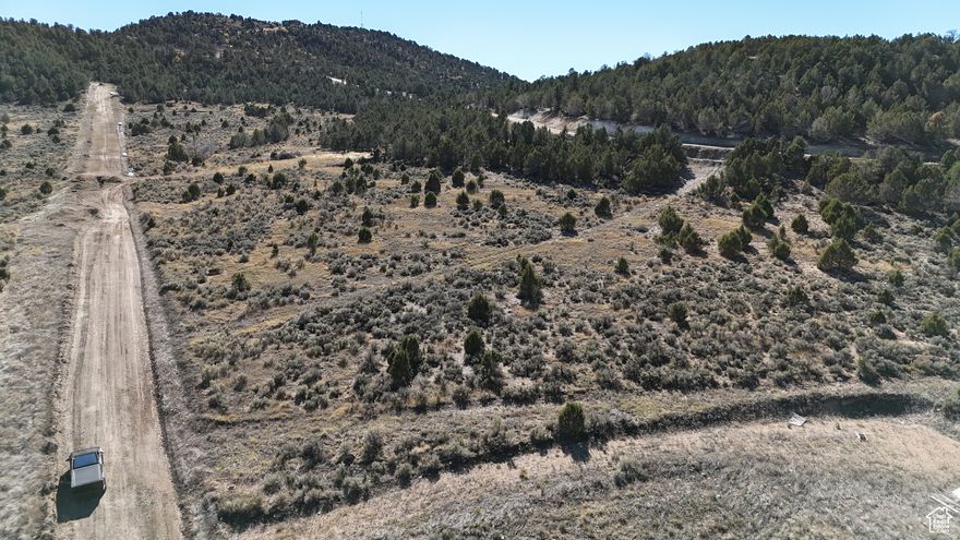 Build your ideal retreat in Black Hawk Estates, a thoughtfully planned community in the quiet hills of Indianola, just 30 minutes from Spanish Fork. This lot is ready to build with culinary water stubbed to the property and power available. There is a culinary water access fee due to water company when connecting. The community is designed for recreation and relaxation, with plans for a private swimming lake, ATV and horse trails, beach volleyball, picnic areas, and more. Whether you're looking for a weekend escape or a long-term build, this lot checks the boxes. The neighboring Lot 23 is also available and includes a prepped driveway/RV pad-buy both to expand your footprint or create a shared family compound. Seller financing available. Google Maps: https://maps.app.goo.gl/HJAjsCv9gpvz4mwy8