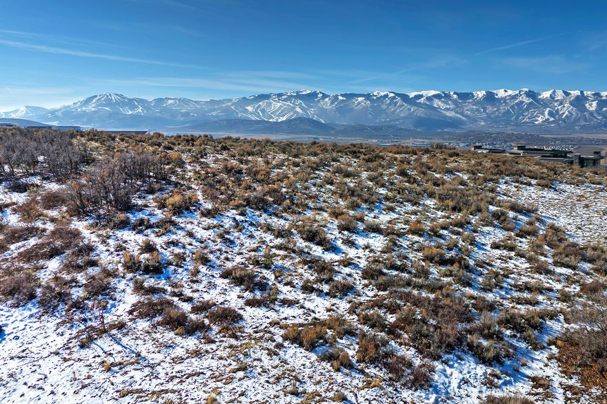 An exceptional opportunity to build your dream mountain retreat on one of the premier homesites in The Pinnacle at Promontory. This expansive 2.43-acre lot offers breathtaking, unobstructed ski mountain views that capture the true essence of Park City living. Gently sloping terrain provides an ideal building envelope for a custom luxury residence, perfectly positioned to maximize privacy and panoramic vistas. Located within the prestigious Promontory community, owners enjoy access to world-class amenities, year-round recreation, and the serenity of alpine surroundings. A rare combination of acreage, views, and location, all within walking distance to the Sky House.