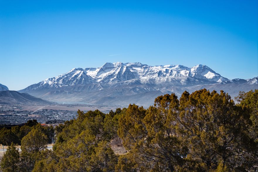 Discover your legacy at Red Ledges, one of Utah's premier mountain communities. Perched at the top of the community, this exceptional homesite captures sweeping views of Mount Timpanogos and the wide-open Heber Valley-an inspiring backdrop for a home designed around how you truly want to live.  Ownership here offers more than land; it unlocks a lifestyle. Enjoy access to the renowned Jack Nicklaus Signature Golf Course, a private clubhouse, and a vibrant village center that brings neighbors together through dining, wellness, and social connection. With all levels of community membership available, you have the flexibility to tailor your experience-from quiet mornings immersed in nature and wildlife to an active calendar of amenities and events. This is a rare opportunity to build something meaningful in a setting that feels both elevated and enduring.