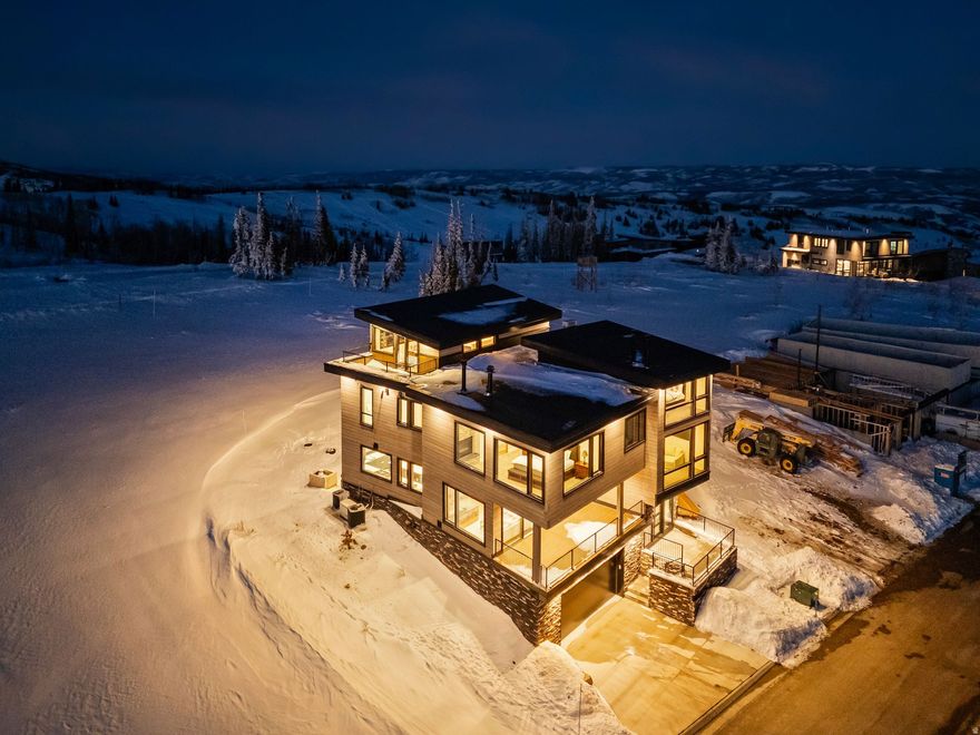 Completed Luxury in Powder Haven at Powder Mountain! Set high above the valley in Powder Haven, this newly built mountain residence is a statement of modern craft and alpine privilege. Natural materials, dramatic stone, and walls of view glass create an atmosphere that feels curated, calm, and undeniably elevated. The arrival experience is intentional, from a stone-floored entry to a light-filled great room that invites long dinners, late fires, and effortless entertaining. The kitchen is sleek and functional, anchored by an expansive island and premium appliance suite, while each bedroom suite offers the privacy and comfort of a boutique retreat. Spa-inspired baths showcase striking tile and stone, double vanities, and a soaking tub designed for slow mornings. A dedicated office adds everyday practicality without compromising the aesthetic. After skiing, hiking, or lake days, the home turns into a private wellness escape with a sauna and a covered terrace with hot tub for a restorative finish. In a community where completed homes rarely come available, this is a scarce opportunity to own now, not later. Powder Haven private ski club membership available for purchase separately and is not included with the home.  Subject to availability, approval, fees, and club terms.