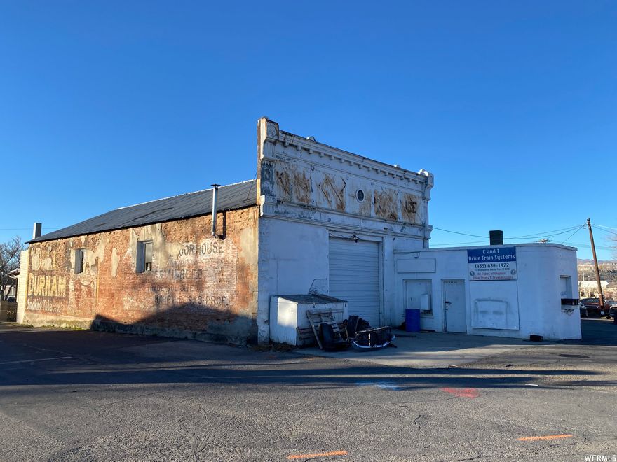 The property features 1 warehouse with an attached house and 1 detached garage with large paved fenced parking lot. Attached warehouse has sq ft: 2350 main level and 2349 basement level. Warehouse has a 1/2 bathroom, office space and gas heat. Warehouse has basement access via cellar door in floor. Detached garage has 110 & 220 power as well as a coal furnace, located at north end of parking lot. House has a great room with fireplace and separate living room, 2 main level bedrooms, full bathroom and a finished bonus room in basement. Square footage figures are provided as a courtesy estimate only and were obtained from tax roll, 2025 survey and appraisal. Buyer is advised to obtain an independent measurement. M2 zoning. Buyer to verify all listing information.