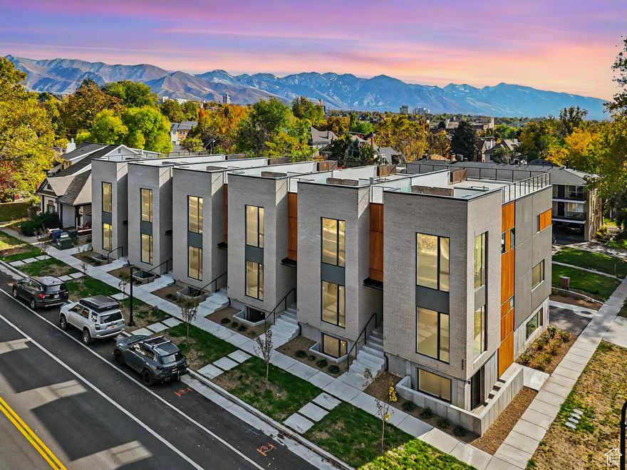 Experience luxury living with a front-row seat to and a view of all of Salt Lake County! This brand-new, fully finished modern townhome in the heart of the Avenues boasts breathtaking panoramic views of the Salt Lake Valley, State Capitol, University of Utah, and majestic Wasatch Mountains from nearly every level, especially the rooftop! Featuring oversized windows, hardwood floors, and high-end finishes throughout, this home offers a chef's kitchen, open-concept living, and a spacious 2-car garage. The exclusive rooftop deck spans over 1,000 sq. ft., providing unmatched outdoor living with space for entertaining, dining, room for a hot tub, and relaxation against the backdrop of the city lights. Perfectly located minutes from downtown, hiking trails, shopping, and dining - this is Salt Lake living at its finest. Fully finished and move-in-ready!