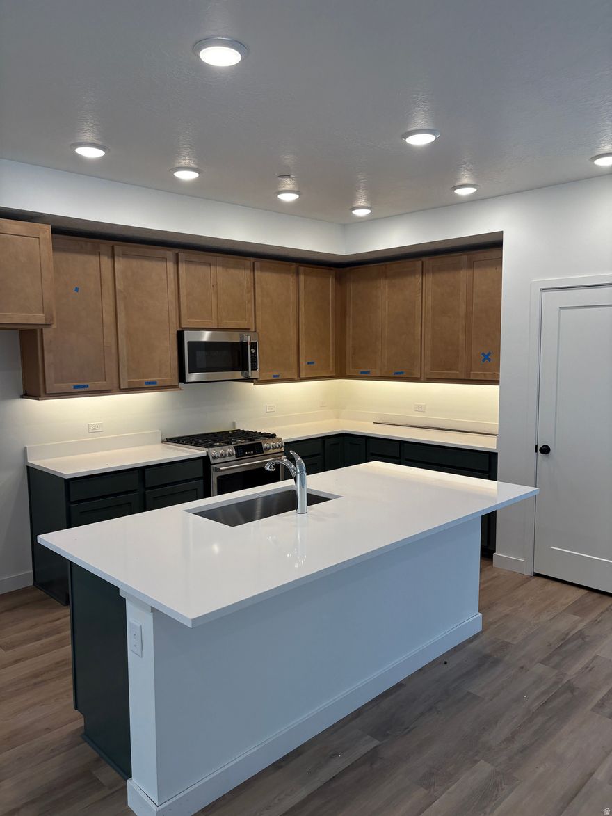 Ask about DWHomes and PHM personalizing your Home Loan! Experience modern luxury in the stunning upscale home near Downtown Daybreak (only 10 minutes away), designed for seamless living and entertaining. Imagine hosting gatherings in your game room with an outdoor terrace- a perfect spot to relax or connect with friends and family. With private guest suites on both the first and third floors, everyone has their own comfortable retreat. Call for an appointment today!