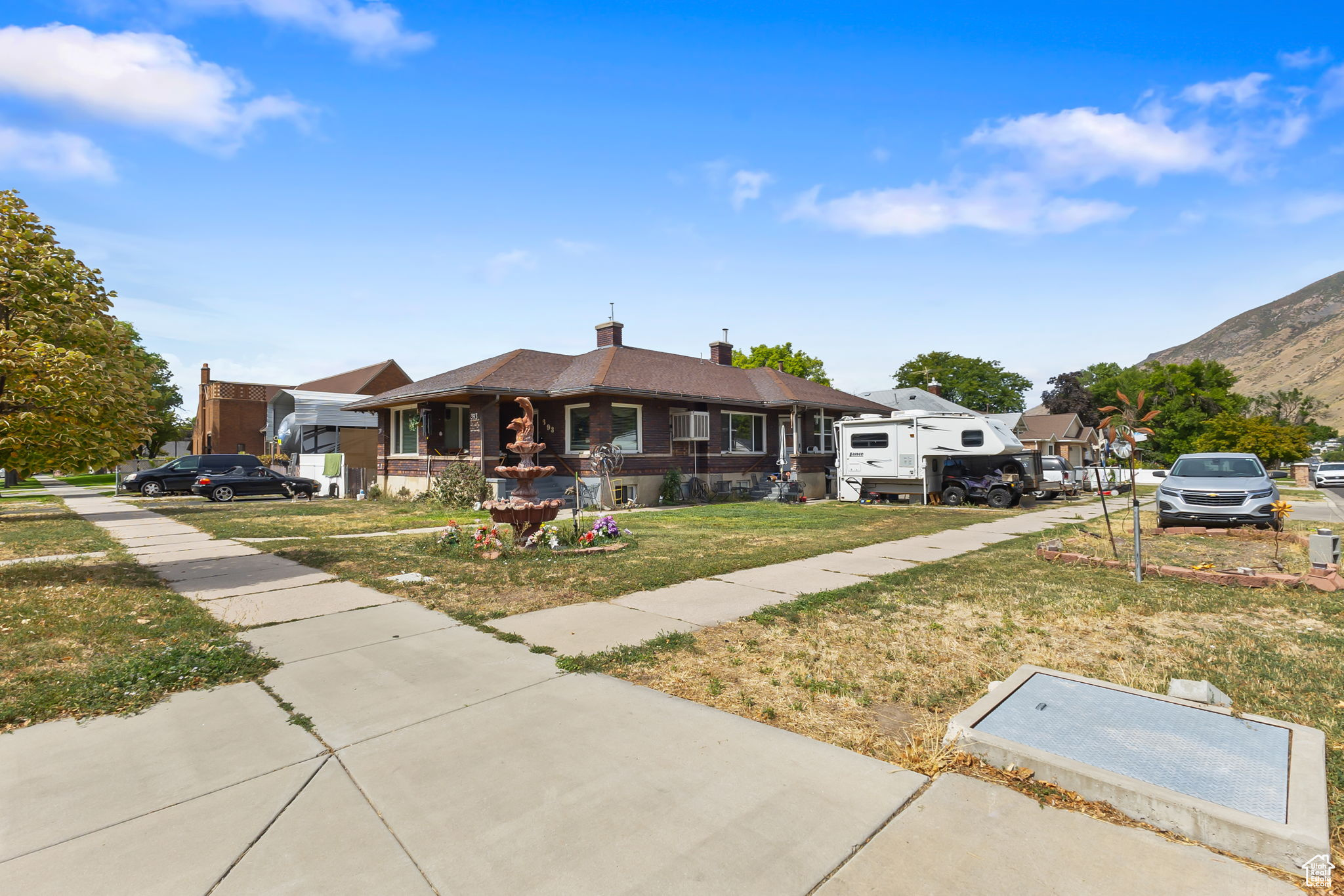Located in the heart of Springville, this home is full of charm, is a legal duplex and close to everything. Plenty of windows for natural light, updated kitchen and bathrooms. Plenty of parking and a 45 ft RV pad in the back. Washers, dryers and refrigerators all negotiable Storage shed in the back with a root cellar. Heated garage. NEW ROOF will be on by the end of the month (Sept.) 70 gallon water heater. Call agent for more information.